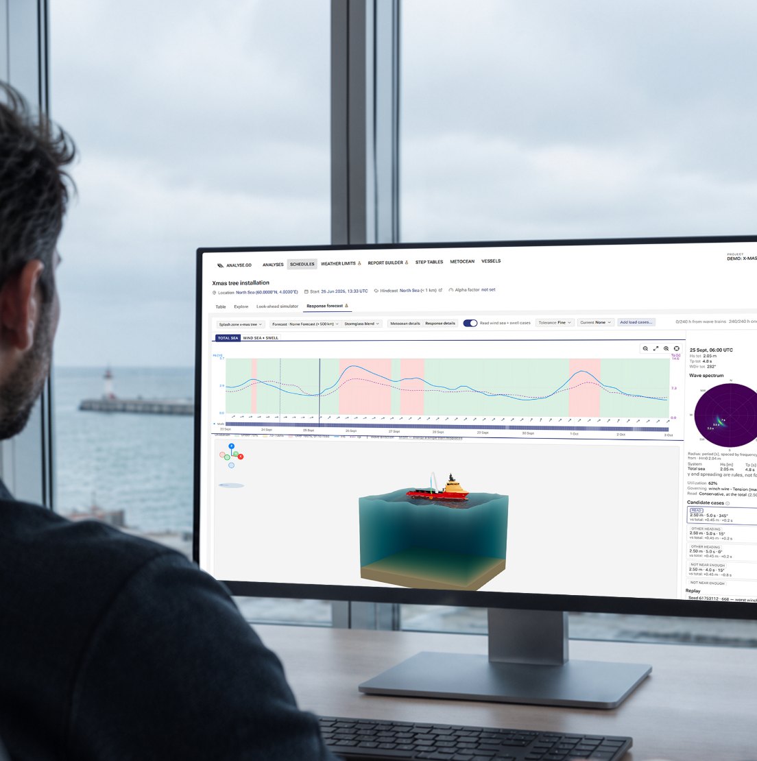 An engineer at a desk reviewing an Analyse.Go analysis, with the sea outside the window